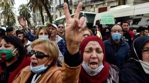Algerian demonstrators march during an anti-government protest in the capital Algiers