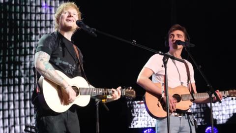 Luke Gittins on stage with Ed Sheeran