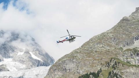 Rescuers fly over Mont Blanc in the search for three missing Italian climbers August 2018