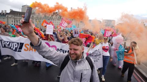 NEU members on strike earlier this year