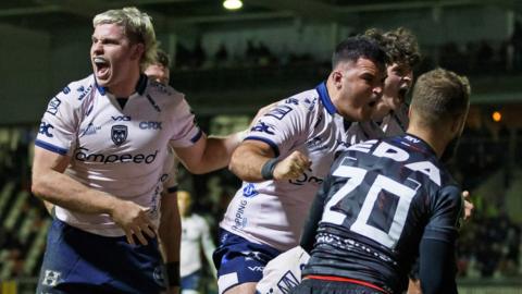 Dragons players celebrate