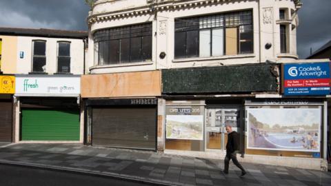 Shops boarded up on Taff Street