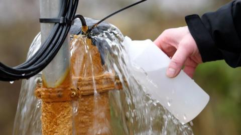 Man collects clean groundwater