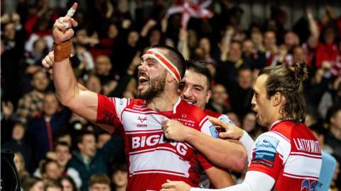 Lewis Ludlow celebrates his try for Gloucester