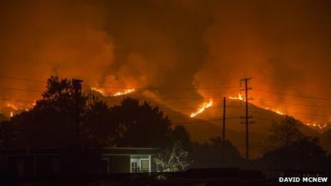 Wildfires threaten houses