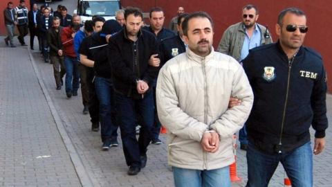 Members of the Turkish police escort suspects of the Gulen movement during nationwide operations, in Kayseri city, Turkey, 26 April 2017.