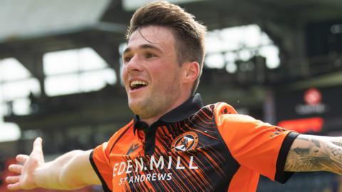 Jamie Robson celebrates scoring for Dundee United against Rangers