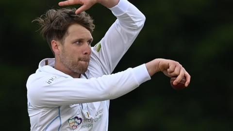 Matt Critchley bowls for Derbyshire