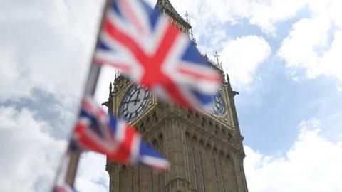 Union flags flutter near the Houses of Parliament in London, Britain, 30 August 2022