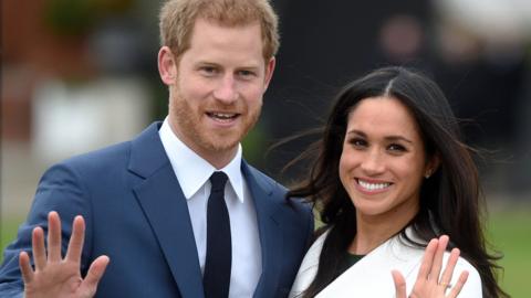 Prince Harry poses with his fiancee, US actress Meghan Markle