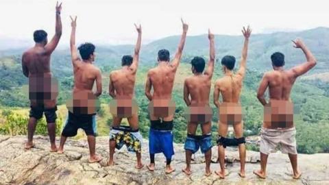 Seven Sri-Lankan men pose semi-naked at Pidurangala Rock