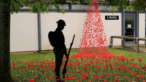 The poppy wave outside the school