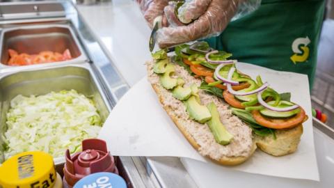 Subway sandwich shop 'artist'.