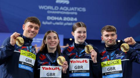 Tom Daley, Scarlett Mew Jensen, Daniel Goodfellow and Andrea Spendolini Sirieix hold up their gold medals