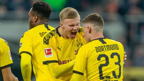 Players from Borussia Dortmund celebrate scoring