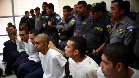 Inmates of Male Juvenile Detention Centre attend a hearing at a court in Guatemala City on March 21, 2017.
