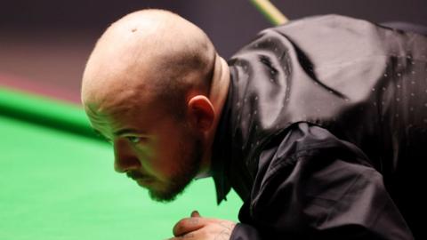 Luca Brecel of Belgium looks on over pool table at the Cazoo World Snooker Championship 2023 at Crucible Theatre on 1 May 2023 in Sheffield, England.