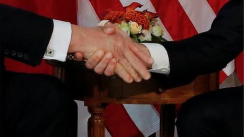 The Trump-Macron handshake