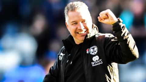 Peterborough United boss Darren Ferguson punches the air in celebration