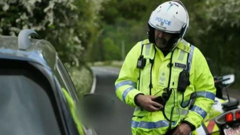 police officer speaking to driver