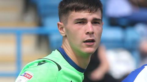 Joe Walsh in action for Gillingham