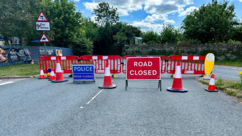 Road closure signs