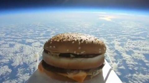 Screengrab from video showing burger in space