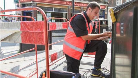 Man installing superfast Virgin Media broadband