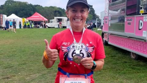 Julie Wragg with medal after ultra-marathon