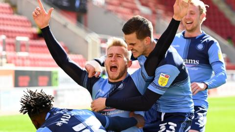 Jason McCarthy celebrates his goal for Wycombe against Rotherham