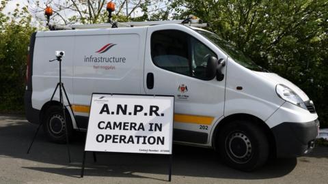 Infrastructure department van with ANPR camera and sign