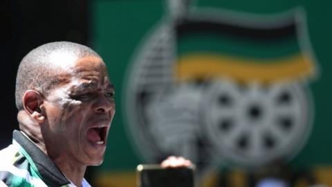 Ace Magashule, the secretary general of South Africa's ruling African National Congress, addresses university students during a protest in Johannesburg