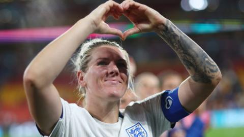 Millie Bright gestures to family in the stands