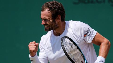 Roman Safiullin celebrates after defeating Joao Fonseca