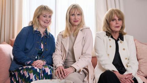 Philippa Dunne
(Anne Flynn) / Lucy Punch
(Amanda) / Joanna Lumley
(Felicity) Sitting left to right, on a pink sofa