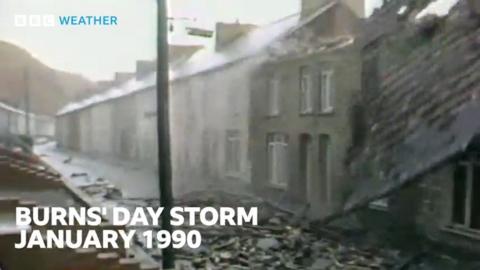 A roof is in the process of falling of a house in a terraced street