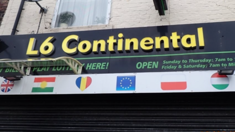 A close up of the shop front of L6 Continental, in yellow lettering over a background