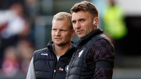 Liam Manning with Chris Hogg in the Bristol City dugout.