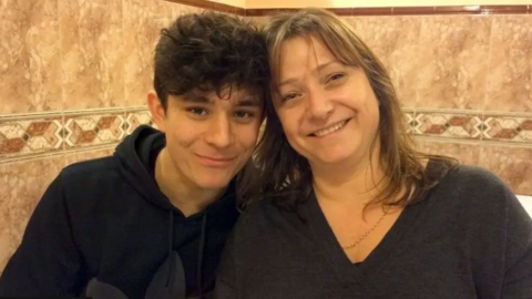 Lucy Alexander pictured with her son, Felix. She has long brown hair and is wearing a V-necked grey jumper. He has curly black hair and is wearing a navy blue hoodie.