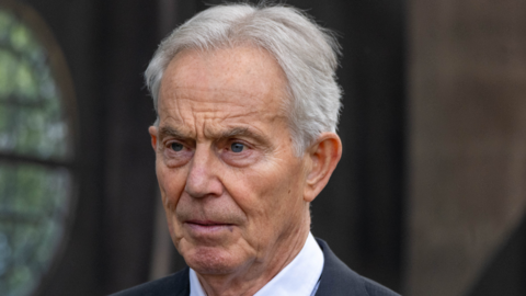 Tony Blair, pictured wearing a dark suit