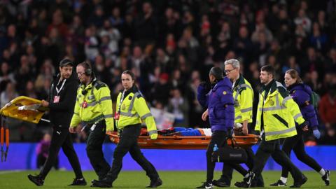 Michelle Agyemang is carried off on a stretcher at Pride Park