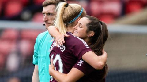 Hearts' Katie Lockwood is replaced by Erin Rennie celebrate