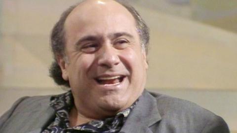 Danny DeVito laughing in the studio.