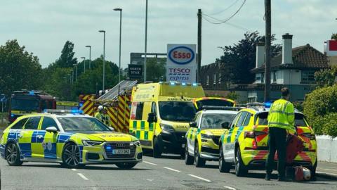 Emergency service vehicles at the scene of the crash.