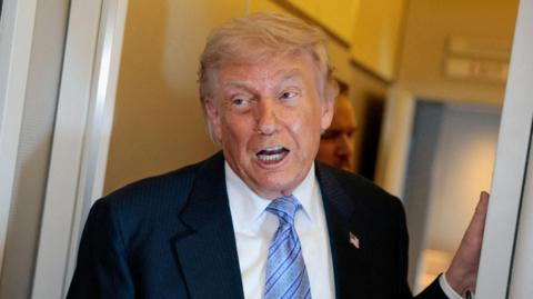 US President Donald Trump speaks to the press aboard Air Force One enroute to the U.S. following his official visit with President Xi Jinping in China, May 15, 2026.
