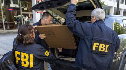 FBI agents depart the office of John Bolton, former National Security Advisor of US President Donald Trump.