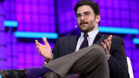 Left-wing streamer Hasan Piker speaking while seated
