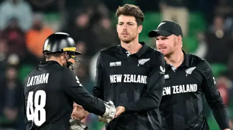 New Zealand players celebrate a wicket