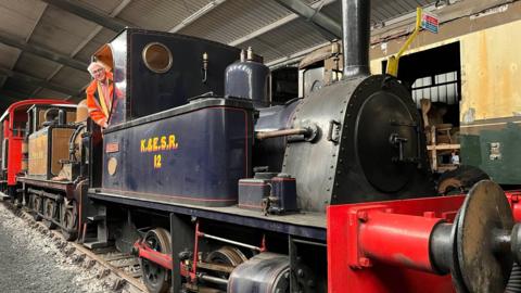 Dr Robin Coomes aboard the locomotive at Kent and East Sussex Railway