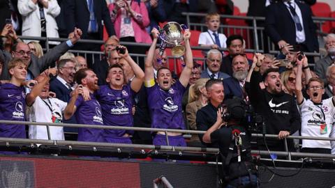 Stoneham lift the FA Vase at Wembley